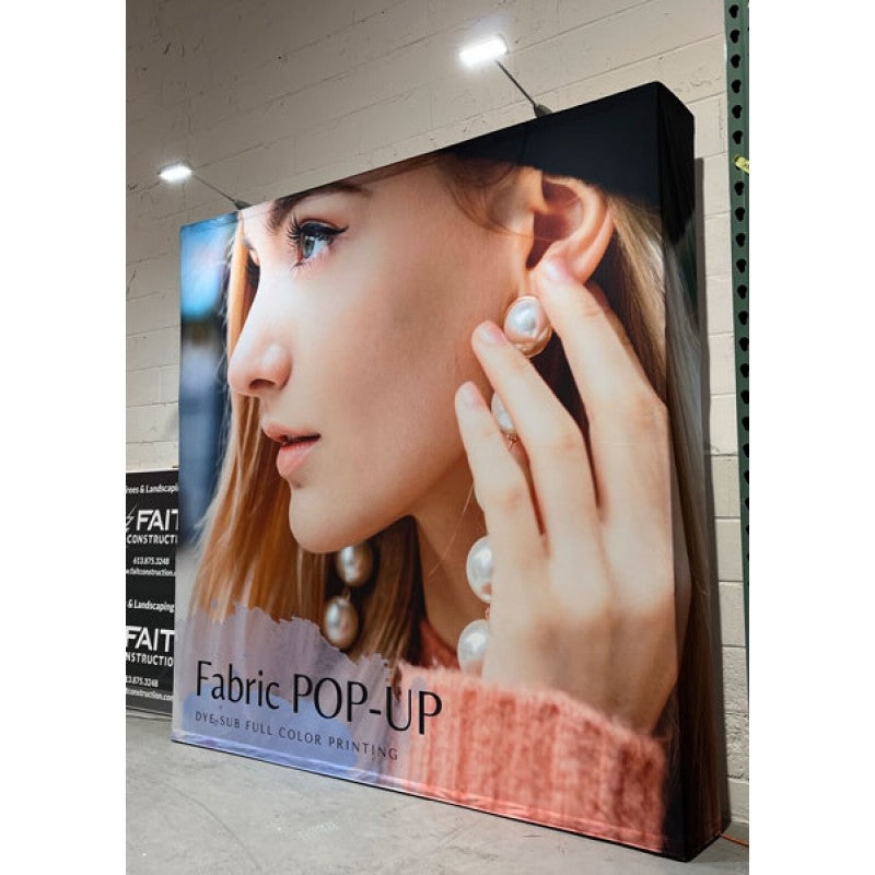 4x8 pop up media wall with dye-sublimation fabric graphics set up at a Toronto trade show booth